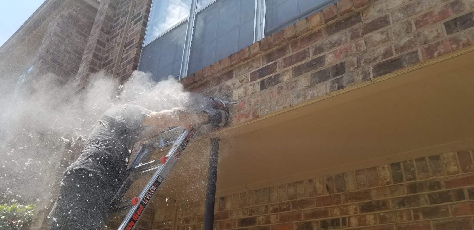 Kleen Dryer Vent technician cleaning an exterior dryer vent